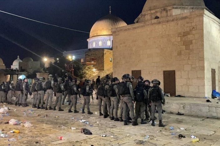 Israeli security forces are seen as they enter Al-Aqsa Mosque in Jerusalem, intervene Muslim worshippers with stun grenade during prayer on May 7, 2021.