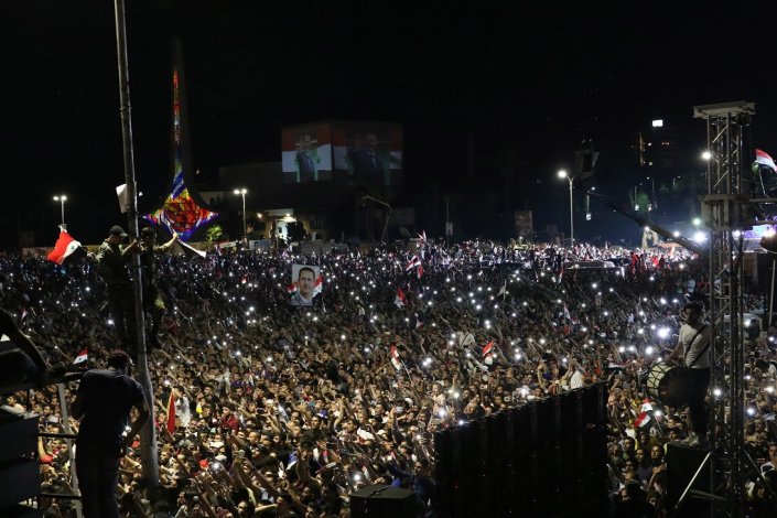 Centenas de milhares de sírios festejaram nas ruas o triunfo de Bashar al-Assad