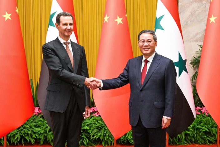 Bashar al-Assad e Li Qiang, no Grande Palácio do Povo, em Pequim, a 25 de Setembro de 2023